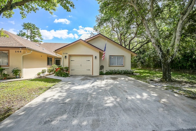 ranch-style home featuring a garage