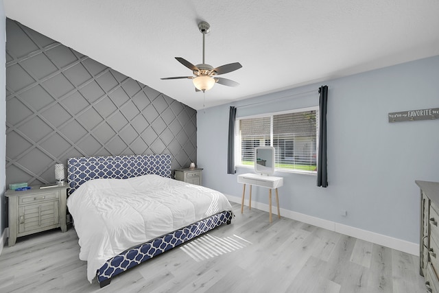 bedroom featuring ceiling fan and light wood-type flooring