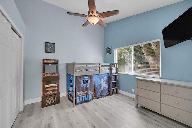 bedroom featuring a closet, ceiling fan, and light hardwood / wood-style floors