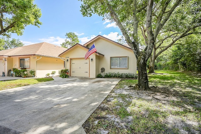 ranch-style home featuring a garage