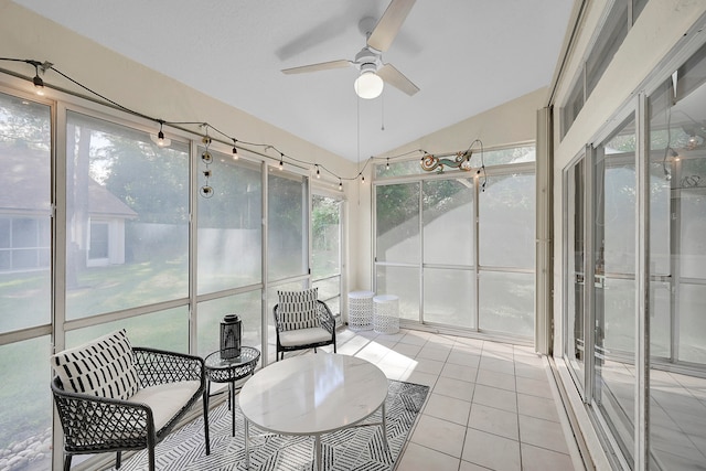 sunroom with ceiling fan and lofted ceiling