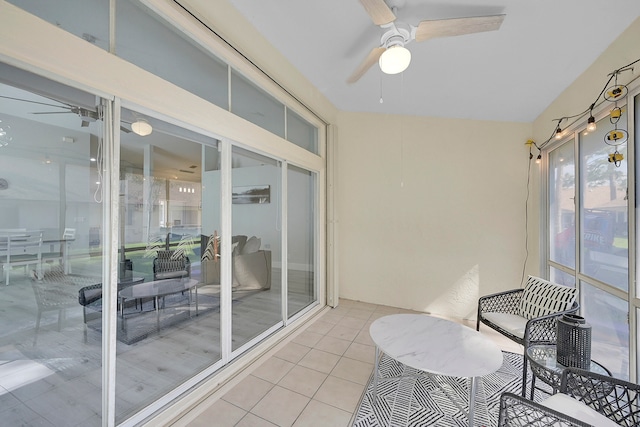 sunroom / solarium with ceiling fan