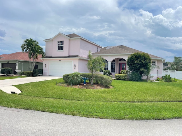 view of front facade featuring a front yard and a garage