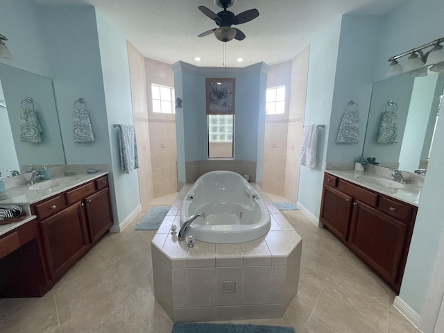 bathroom with plenty of natural light, ceiling fan, independent shower and bath, and vanity