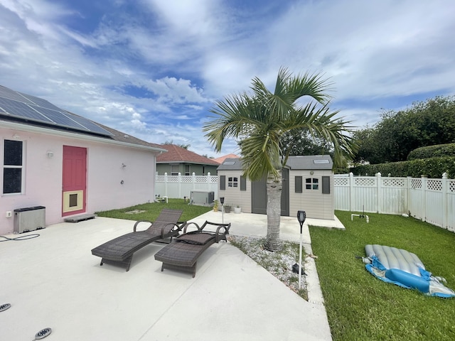 view of patio featuring central AC and an outbuilding