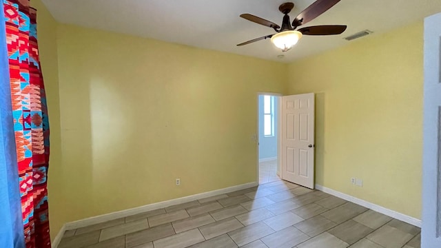 spare room with ceiling fan