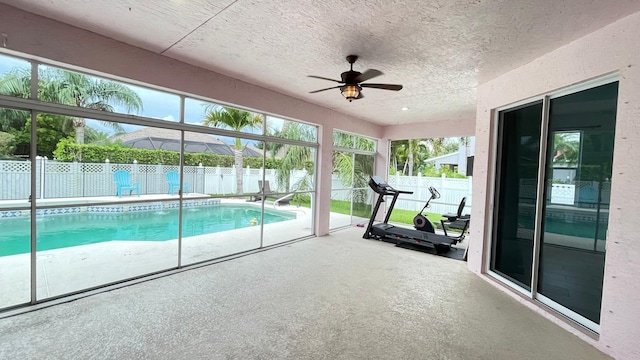 view of pool featuring ceiling fan and a patio area