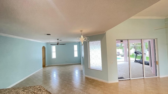 unfurnished room with a notable chandelier, ornamental molding, and a textured ceiling