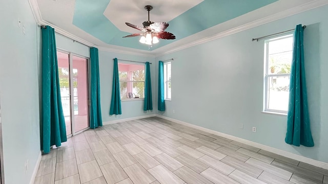 spare room featuring ceiling fan and crown molding