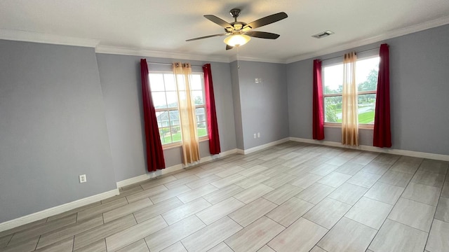 spare room with a wealth of natural light, ceiling fan, and crown molding