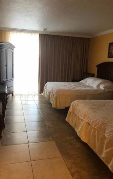 bedroom featuring tile floors