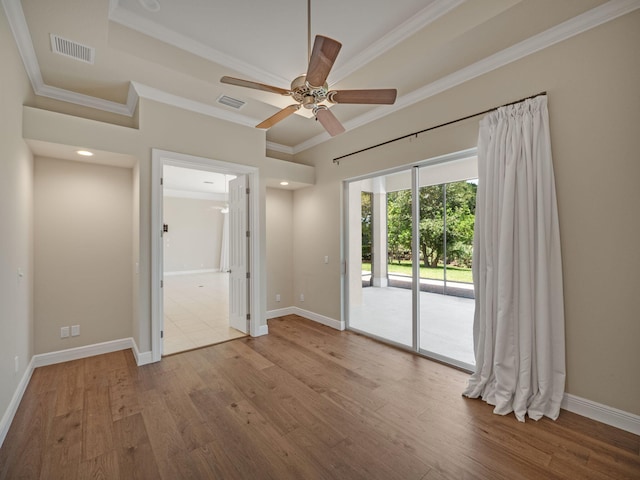 unfurnished room featuring ceiling fan, ornamental molding, and hardwood / wood-style floors