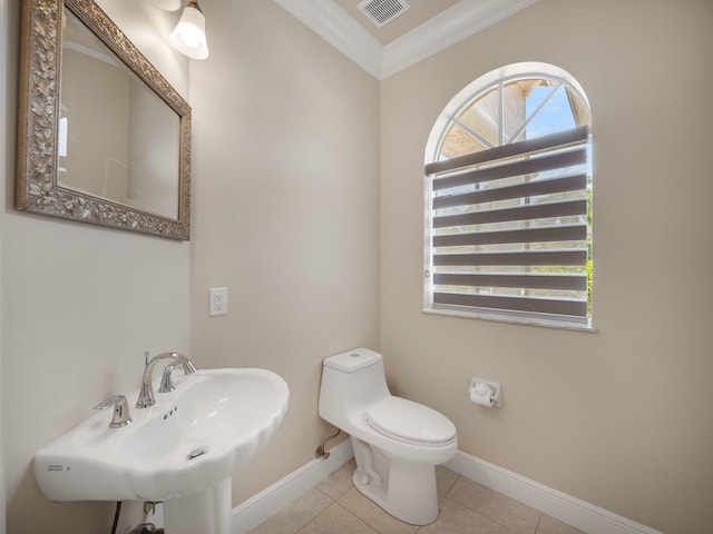 bathroom featuring sink, crown molding, toilet, and tile patterned floors