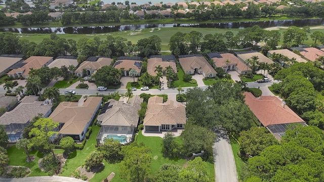 bird's eye view with a residential view and a water view