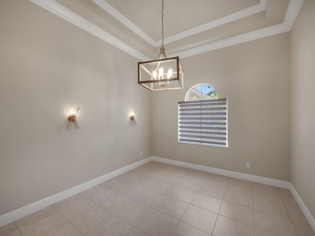 tiled spare room featuring an inviting chandelier and ornamental molding