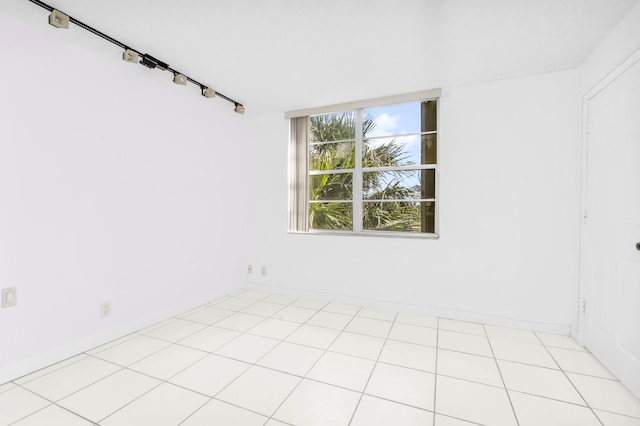 empty room with light tile patterned floors