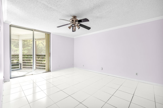 spare room with ceiling fan, crown molding, a textured ceiling, and light tile patterned floors