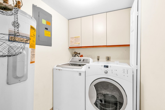 laundry room featuring cabinets, electric panel, and washer and clothes dryer