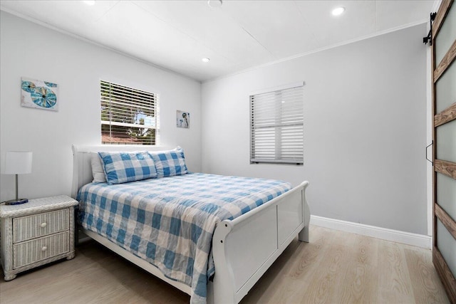 bedroom with baseboards, recessed lighting, light wood-style floors, and ornamental molding