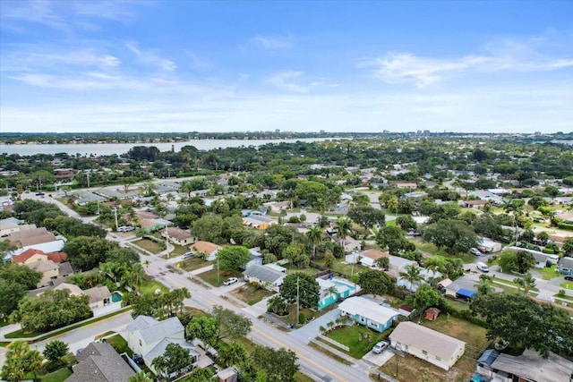 drone / aerial view featuring a residential view and a water view