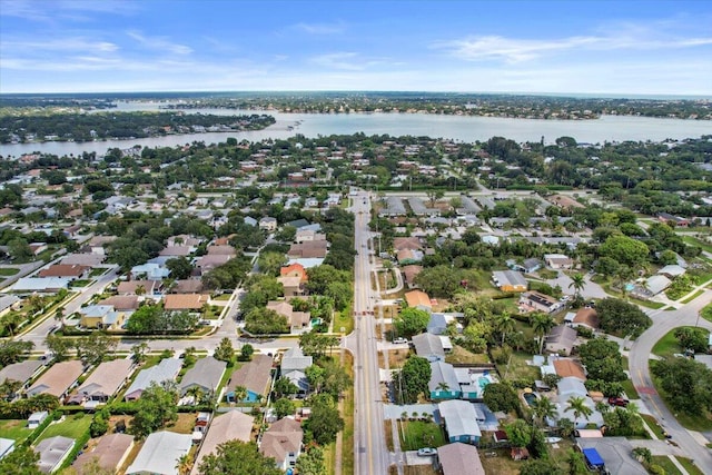drone / aerial view with a residential view and a water view