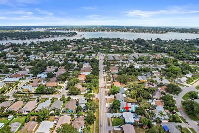 birds eye view of property with a residential view and a water view