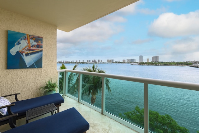 balcony featuring a water view