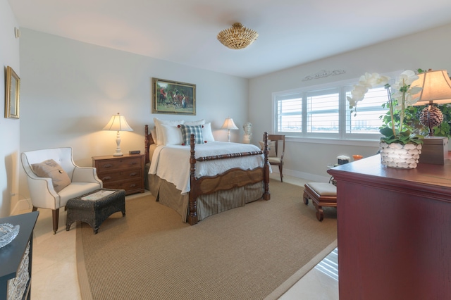 bedroom featuring light carpet