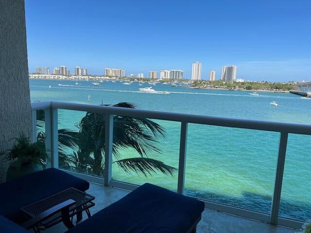 balcony featuring a water view