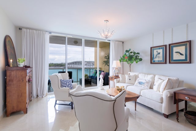 living room featuring a water view, expansive windows, a notable chandelier, and light tile patterned floors