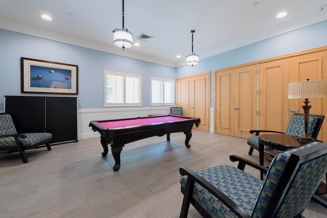 rec room with light wood-type flooring, ornamental molding, and pool table