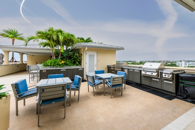 view of patio featuring area for grilling and an outdoor kitchen