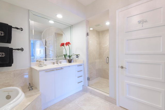 bathroom featuring vanity, plus walk in shower, and tile patterned floors