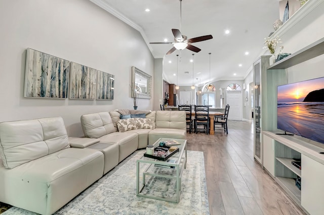 living room with crown molding, high vaulted ceiling, ceiling fan, and hardwood / wood-style floors