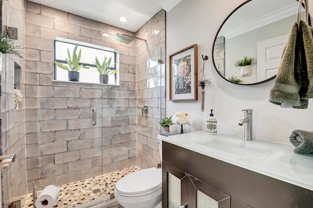 bathroom featuring an enclosed shower, ornamental molding, toilet, and oversized vanity