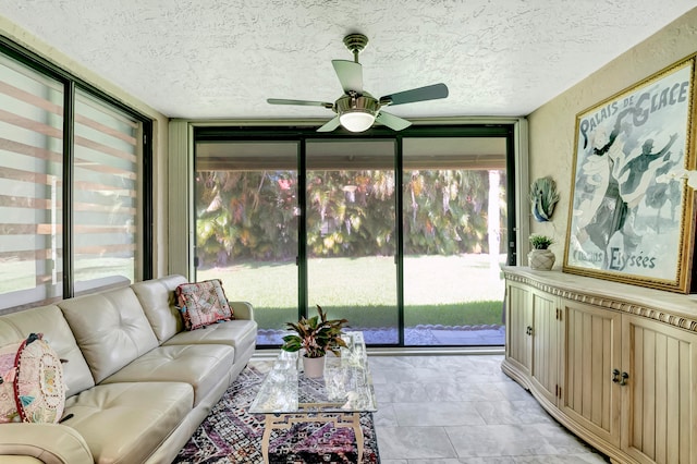 sunroom featuring a wealth of natural light and ceiling fan