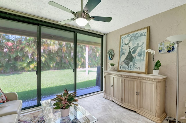 sunroom / solarium with ceiling fan