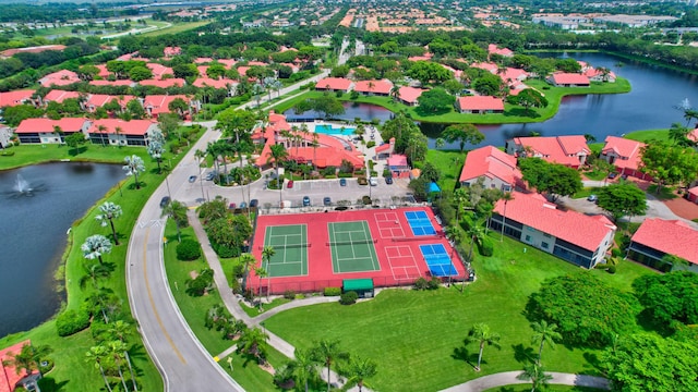 birds eye view of property with a water view