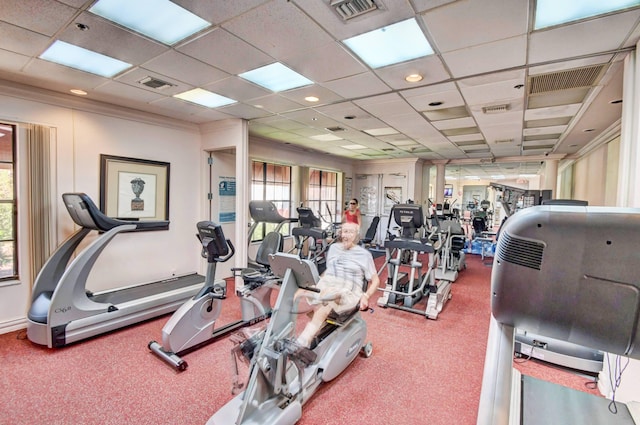 exercise room with carpet and a drop ceiling