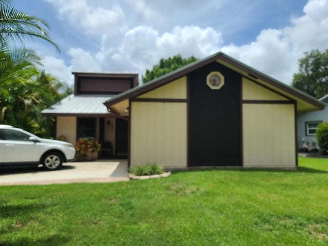 view of side of home featuring a yard