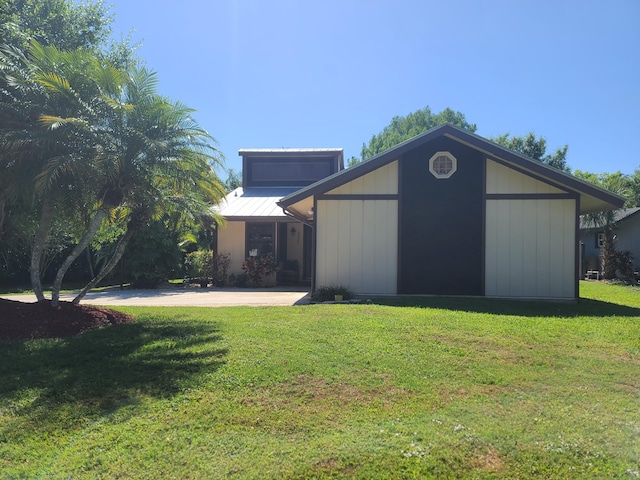 view of outdoor structure with a lawn