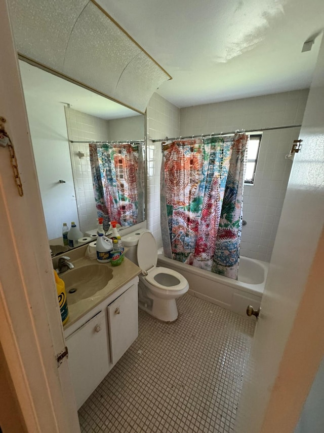 full bathroom with vanity, toilet, and shower / bath combo