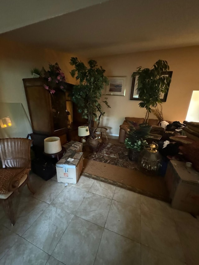 unfurnished living room with light tile patterned floors