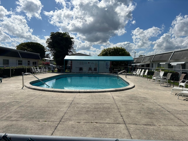 view of swimming pool with a patio