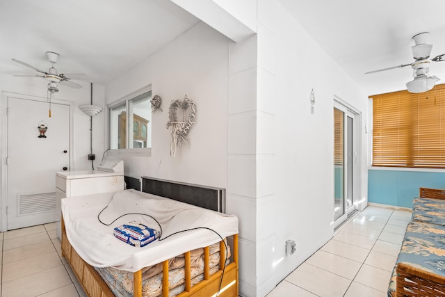 interior space featuring tile floors and ceiling fan