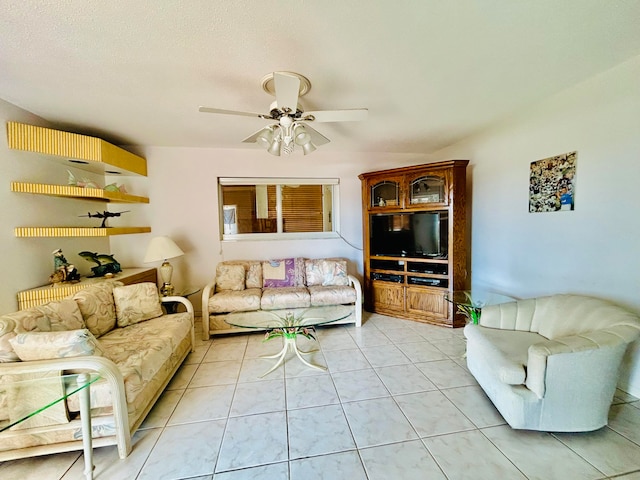 living room with light tile floors and ceiling fan