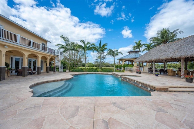 view of swimming pool featuring a patio area and a gazebo