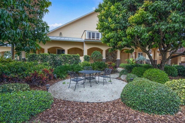 back of house with a patio area