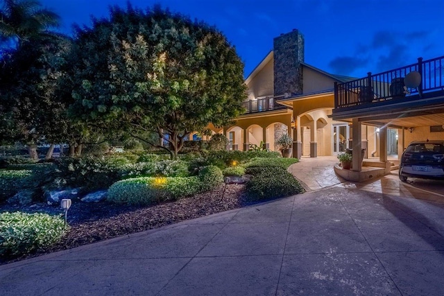 view of front of house with a balcony