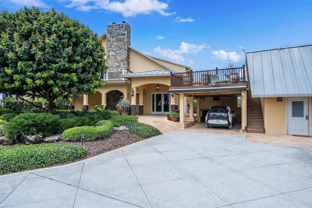 view of front of property with a carport